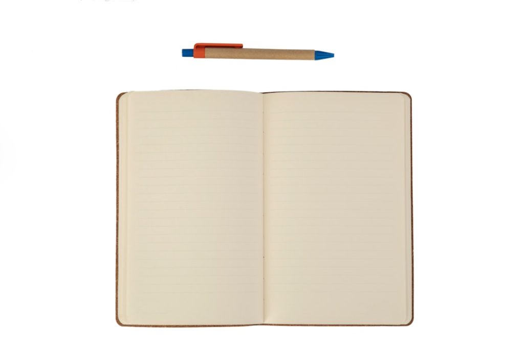 Cuaderno y lápiz para anotar cómo afecta el dolor antes de una consulta
